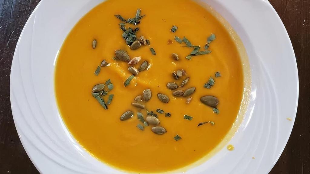 Butternut Squash Soup · Roasted pumpkin seeds, fresh tarragon, chicken broth.
