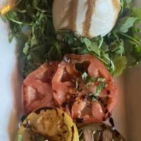 Burrata Salad · Heirloom tomatoes, arugula, basil, balsamic, olive oil