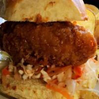 Fried Chicken Sandwich · Coleslaw and dill pickles on a brioche bun. Served with fries or salad.