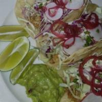 Fish Tacos · guacamole, pickled onion, red and green cabbage, radish, cilantro and lime