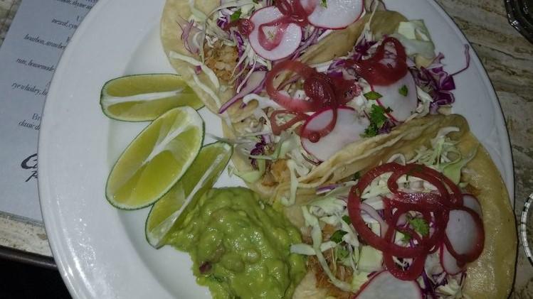 Fish Tacos · guacamole, pickled onion, red and green cabbage, radish, cilantro and lime