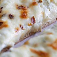 White Ricotta Pizza Slice · Mozzarella and ricotta cheeses and fresh basil. (No marinara sauce).