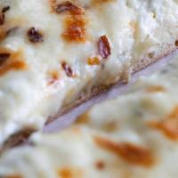 White Ricotta Pizza Pie · Mozzarella and ricotta cheeses and fresh basil. (No marinara sauce).