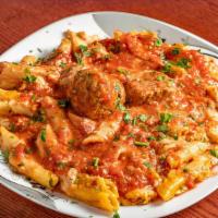 Penne With Meatballs · Penne style pasta beaded with fresh cooked beef
meatballs and marinara sauce.