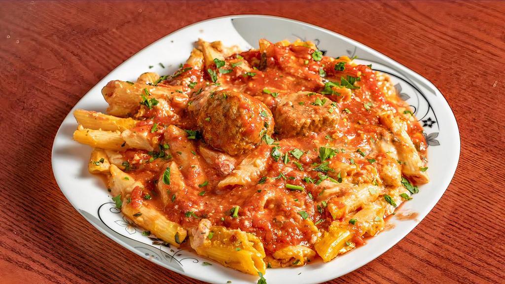 Penne With Meatballs · Penne style pasta beaded with fresh cooked beef
meatballs and marinara sauce.