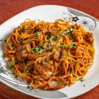 Meat Sausage Spaghetti · Spaghetti style pasta beaded with warm beef meat
sauce.