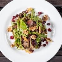 Insalata Alla Catena · Baby mixed greens with walnuts, dried cranberries, olive oil, and reduced balsamic.