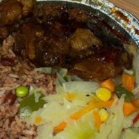 Oxtail · Served with your choice of rice or Rasta pasta and a choice of garden salad or steamed veget...