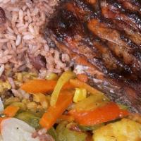 Jerk Salmon · Served with your choice of rice or Rasta pasta and a choice of garden salad or steamed veget...
