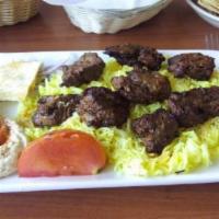 Beef Kabob Plate · Served with seasoned rice and a salad of mixed greens, tomatoes, and cucumber.