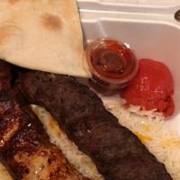 Koobideh Kabob Plate · Served with seasoned rice and a salad of mixed greens, tomatoes, and cucumber.