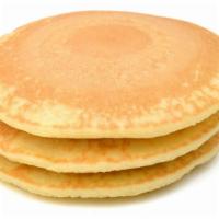 Pancakes · Short stack of simple pancakes with syrup.