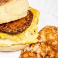 Vegan Sausage And Egg · Vegan Sausage, Egg Patty and Cheese Served on  Bagel with Hash Brown.