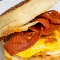 Vegan Bacon And Egg · Vegan Bacon, Egg Patty and Cheese Served on Bagel with Hash Brown