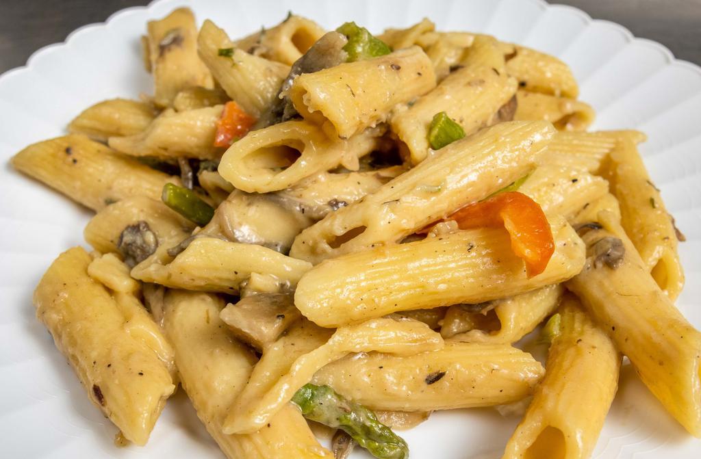 Rasta Pasta · Vegan Roasted Pepper Blend, Onion, Asparagus and Penne Noodles with our Creamy Rasta Sauce.