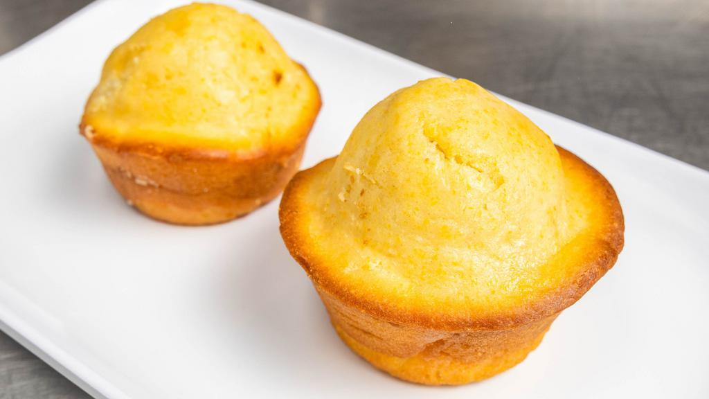 Vegan Sweet Potato Corn Bread Muffin · Two pieces. Southern style cornbread stuffed with spiced sweet potato.