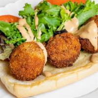 Vegan Po’ Boy Sandwich · Vegan Hand Crafted Tuna Balls on a Fresh Roll with Coleslaw, Tomato and Butter Pickles with ...