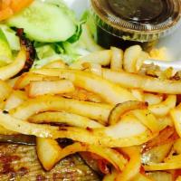 Bistec Encebollado /  Steak & Onions · Served with: Rice, Beans, Salad and tortillas