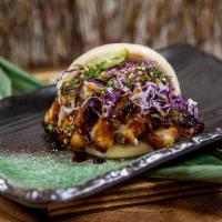 Two  Original Pork Buns · Melt-in-your-mouth braised pork belly with a cabbage slaw, and umami shoyu reduction.