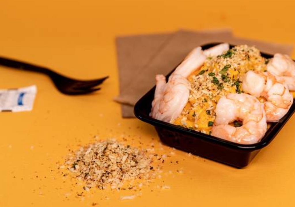Truffle Shrimp Mac & Cheese · Macaroni prepared with a homemade cheese sauce, bread crumbs, white truffle, and plump shrimp.