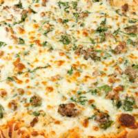 Steak In The Grass Pizza · White garlic sauce, steak, fresh spinach, and mozzarella cheese.