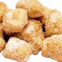 Original Fried Yummy Dough · Our fresh daily made dough lightly fried then tossed in our blend of cinnamon and sugar.