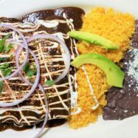 Enchiladas · Three flour tortillas filled with your choice of meat topped with salsa (mole or green or re...