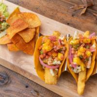 Baja Fish Tacos · Three pieces. Napa slaw, pickled red onion, pico de gallo, lettuce, mango, cilantro, choice ...