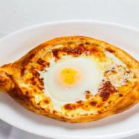 Acharuli · Boat shape dough topped w/cheese, raw egg & butter.