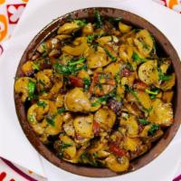 Mushrooms Kaxetian Style · stewed mushrooms with tarragon greens and onions