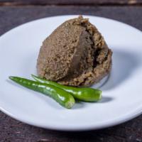 Shutki Bhorta (Dried Fish Mash) · Four ounce. container of Shutki Bhorta - spicy, dried fish mashed into a paste-like consiste...