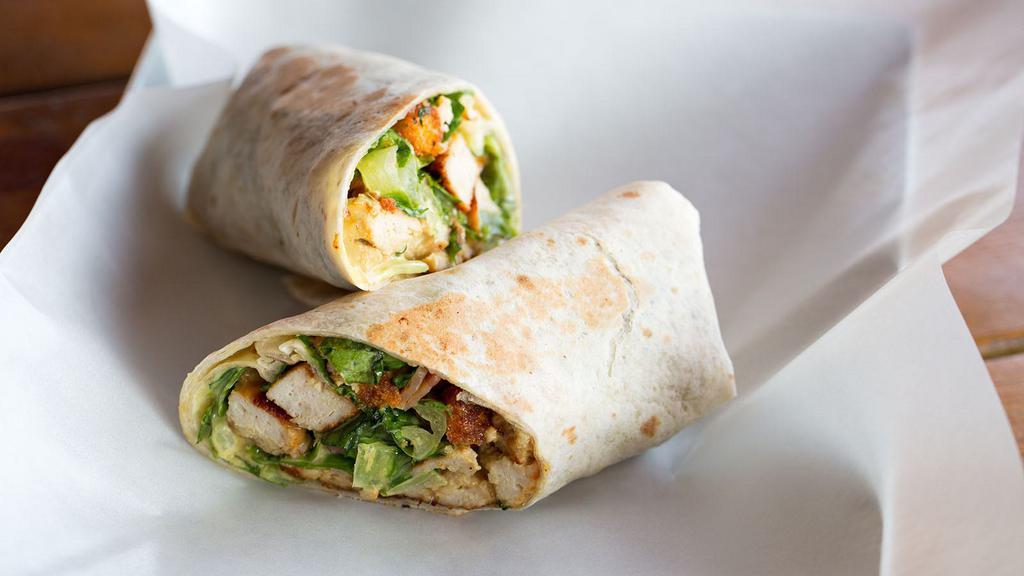 Chicken Salad Wrap · Wonderful white chicken salad, Pepper Jack cheese, creamy avocado, lettuce, and tomato in a wrap.