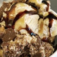 Happy Turtle · Butter pecan ice cream topped with chocolate and caramel syrups and some snicker candy.
