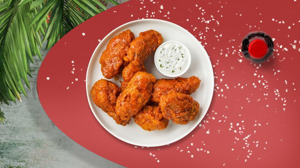 Habanero Flames Wings · Fresh vegan wings breaded, fried until golden brown, and tossed in mango habanero sauce. Served with a side of vegan ranch or vegan bleu cheese.