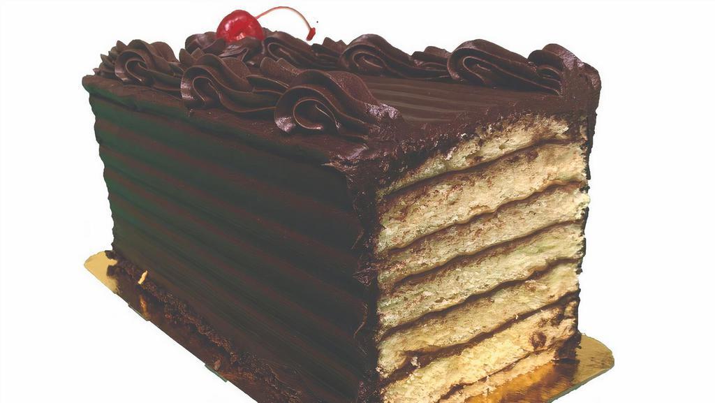 7 Layer Cake - Small · Seven thin layers of Vanilla Cake alternating with a thin layer of Chocolate Buttercream and topped with hard chocolate icing