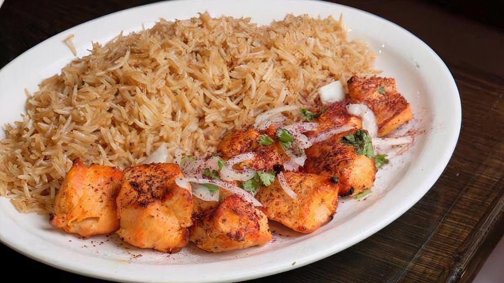 Chicken Tikka Kebab · Chicken breast marinated, grilled & served with brown basmati rice and salad.