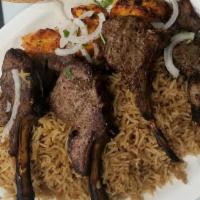 Lamb Chop (4 Pieces) · Pieces of marinated lamb chops grilled & served with brown basmati rice and salad.