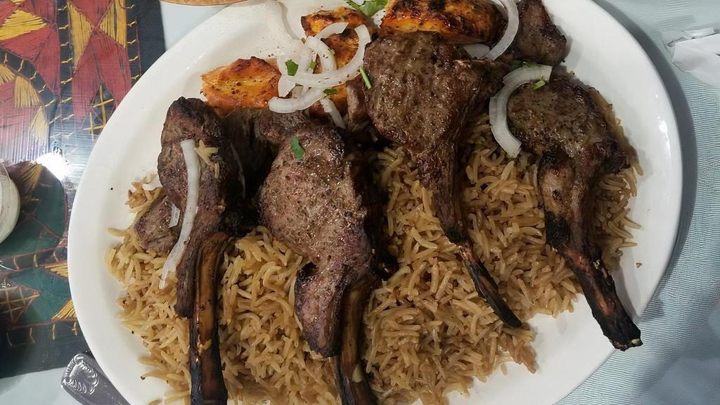 Lamb Chop (4 Pieces) · Pieces of marinated lamb chops grilled & served with brown basmati rice and salad.