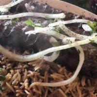 Lamb Kofta Kebab · Ground lamb kebab, grilled & served with brown basmati rice and salad.