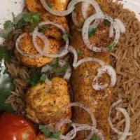 Combo 1 · Chicken tikka and chicken kofta with brown basmati rice and salad.