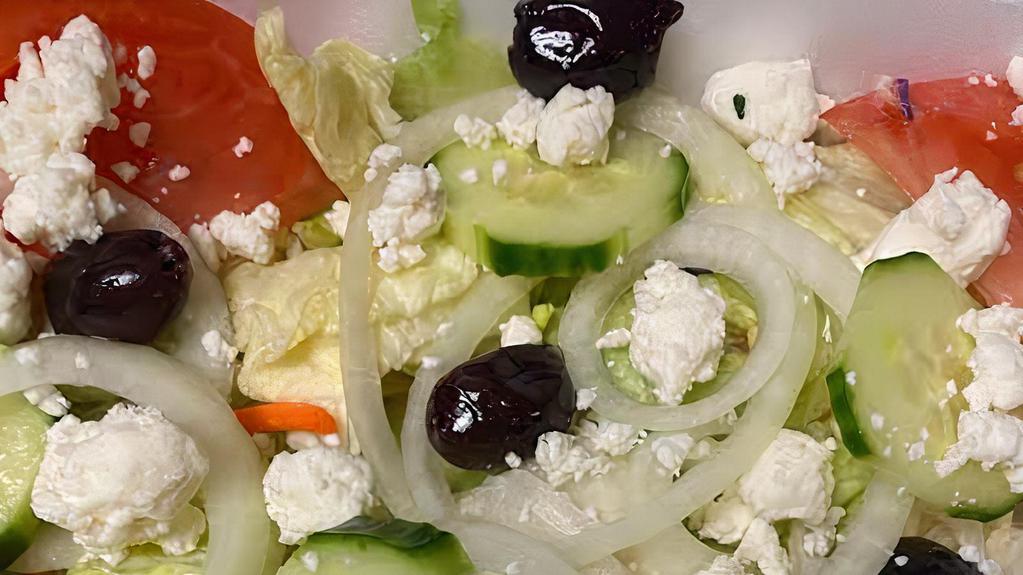 Greek Salad · Mixed greens with tomato, cucumbers, olives, onions, feta cheese and Greek dressing.