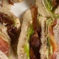 Turkey Club · With bacon, lettuce, tomato and mayonnaise.