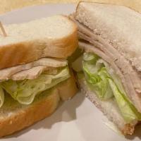 Roast Turkey Sandwich · Fresh roasted turkey served on your choice of bread with lettuce & mayonnaise. comes with po...