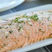 Poached Salmon · In parchment paper, lemon, butter, capers, sun-dried tomato.