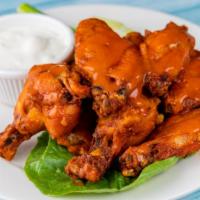 Buffalo Chicken Wings · Served with blue cheese and celery.