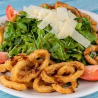 Cassie'S Stacked Salad (Individual) · Baby arugula, asparagus, tomato, and honey balsamic dressing. Fried calamari topped with shr...