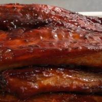Bar-B-Q Spare Ribs · A cut of meat from the bottom section of the ribs. that have been broiled roasted or grilled.