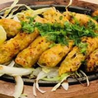 Chicken Cheese Kabab · Minced chicken stuffed with cheese and fresh herbs, grilled tender and juicy.