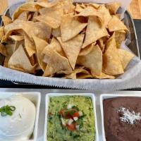 Chips And Dip · House made corn chips served with your favorite dip.