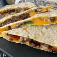 Steak Quesadilla · Steak, peppers, onions with melted cheese in a grilled flour tortilla. Served with a side of...